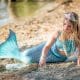 MERMAID DRAWS IN SAND WITH STICK IN OKANAGAN